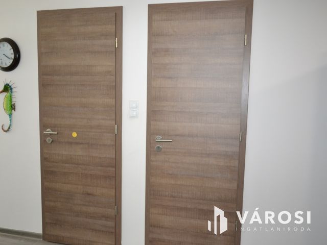 Újszerű 2+4 szobás földszinti kertkapcsolatos Balatonfüreden