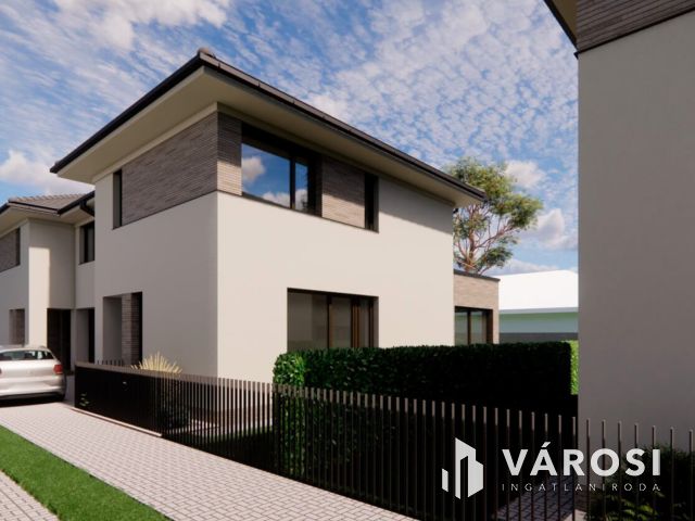 Debrecen csendes kertvárosi részén ELADÓ IKERHÁZ